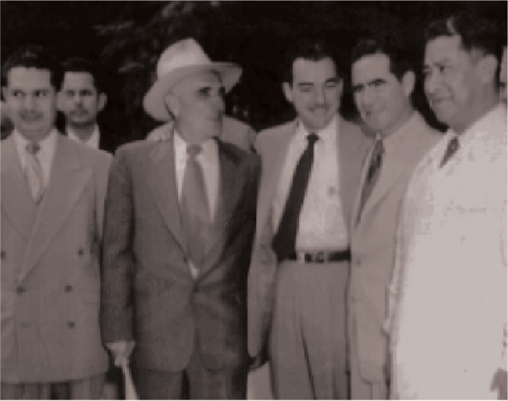 Group picture of Alberto Aldrete with a group of five other businessmen.