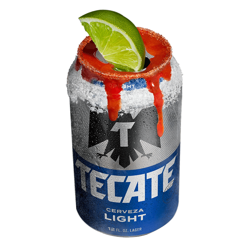 Tecate® Light can with a lime, salt and some hot sauce on top.